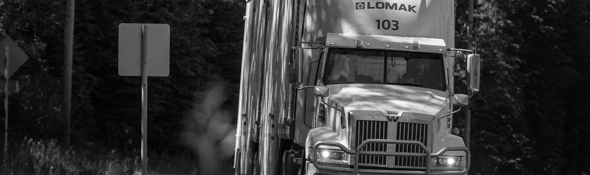 Lomak truck driving down a road